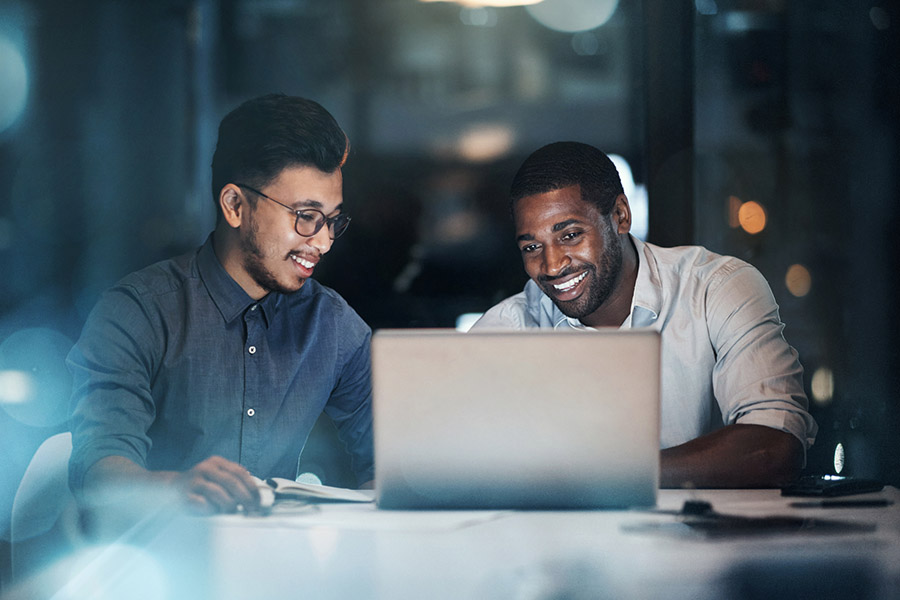men working on laptop