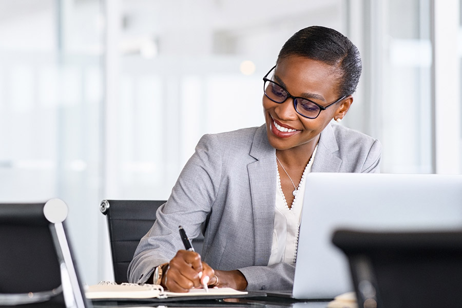 woman in office working on laptop