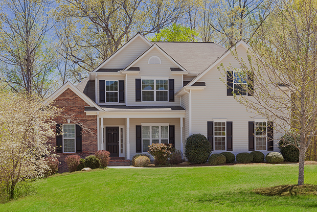 Article thumbnail link to: large family home with green lawn and spring trees